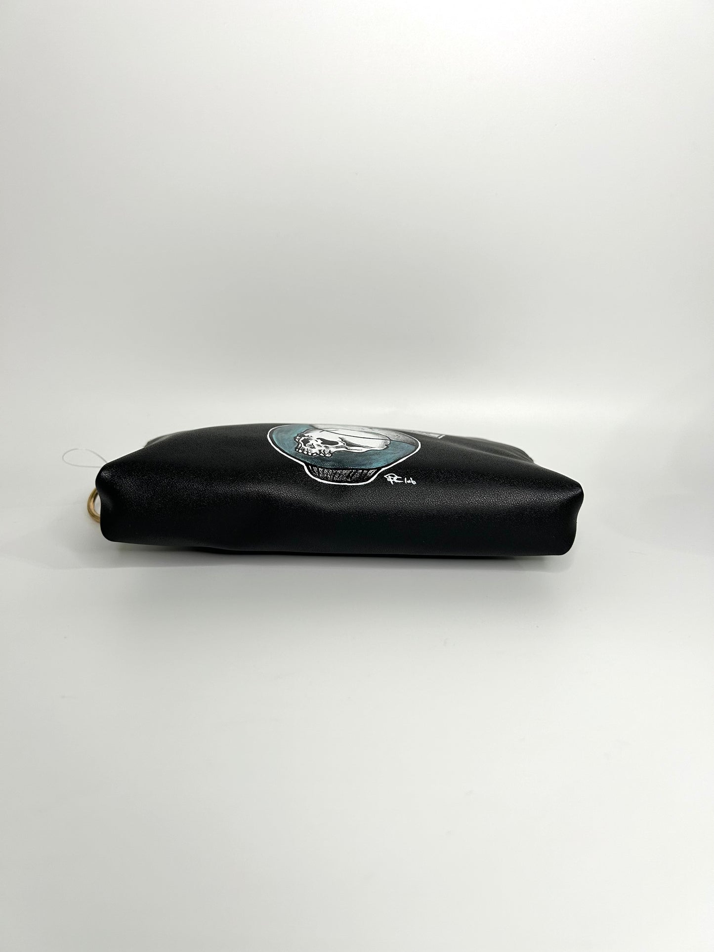 Pochette nera, pozione teschio